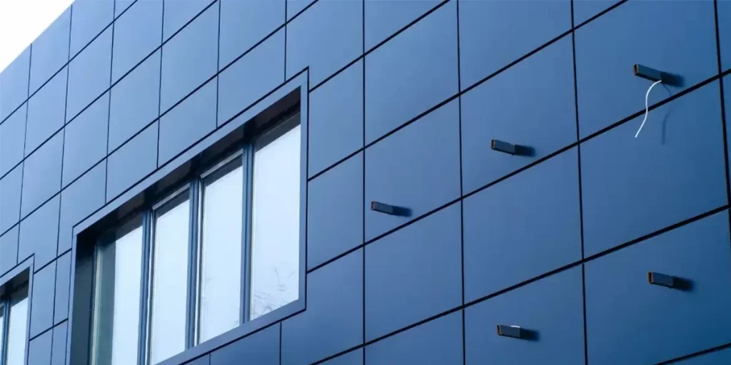 Contemporary building facade with sleek aluminium cladding panels creating a modern and low-maintenance exterior.