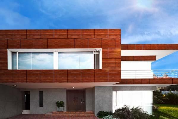 Contemporary architectural elevation showcasing Delby Sapphex waterproof and UV-stabilized exterior cladding panels with warm accent lighting.